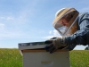 Mom checking a hive at Hardscrabble Hollow Farm, Rutherfordton, North Carolina